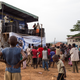 An outreach caravan organized by the Uganda Youth Network informs children and young people in a Kampala neighbourhood about the Youth Manifesto, civic engagement and conflict resolution.